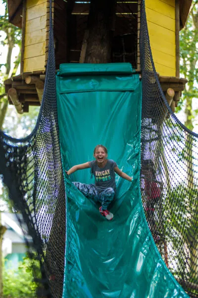 Perched hut and slide